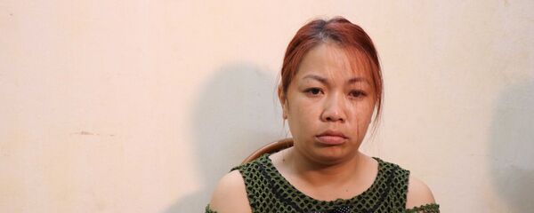 Đối tượng Nguyễn Thị Thu tại Cơ quan Cảnh sát điều tra. - Sputnik Việt Nam