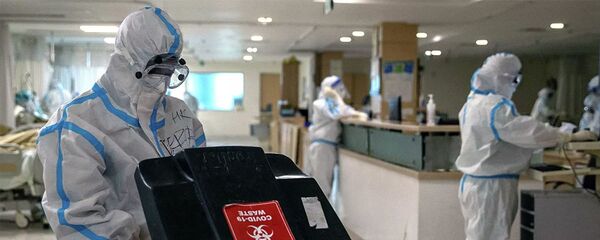Các bác sĩ mặc đồ bảo hộ tại một bệnh viện ở New Delhi, Ấn Độ Các bác sĩ mặc đồ bảo hộ tại một bệnh viện ở New Delhi, Ấn Độ - Sputnik Việt Nam