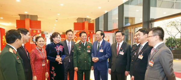 Các đại biểu gặp gỡ bên lề phiên họp sáng 30/1. Các đại biểu gặp gỡ bên lề phiên họp sáng 30/1. - Sputnik Việt Nam