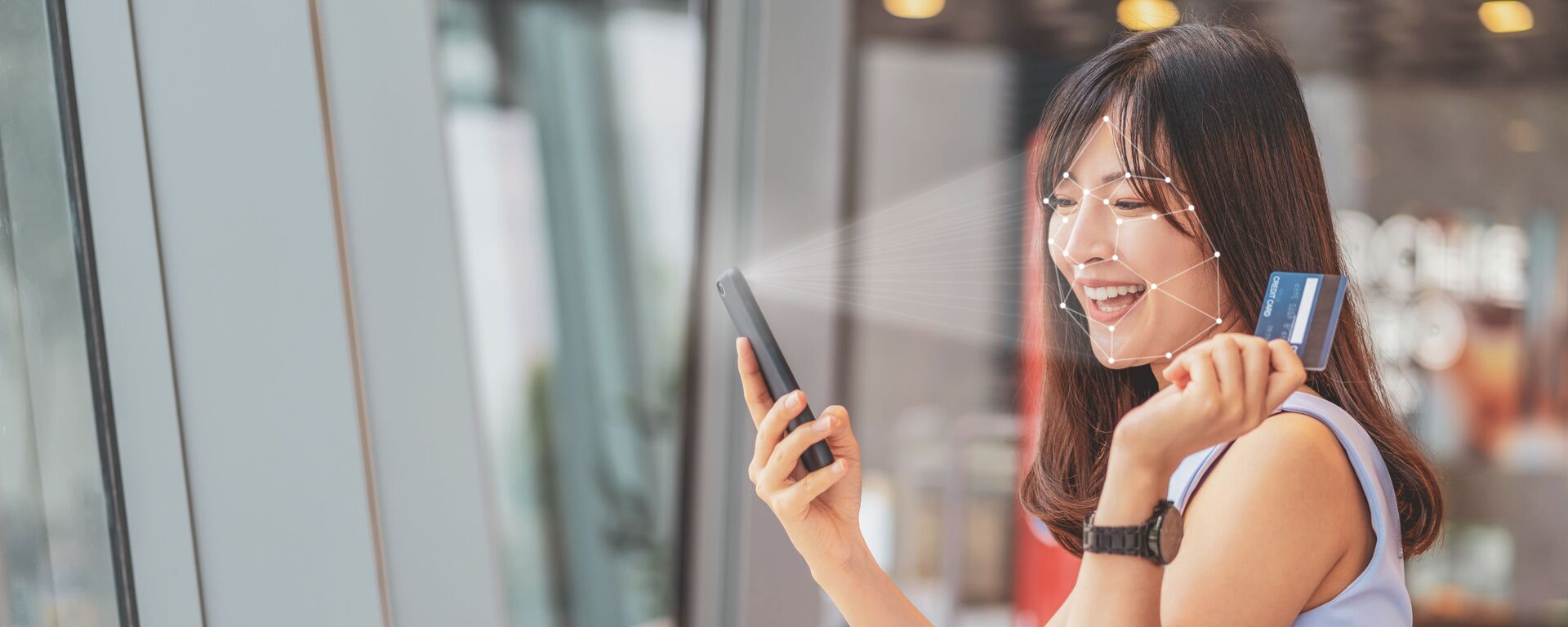 Азиатская девушка использует биометрическую верификацию на мобильном телефоне - Sputnik Việt Nam, 1920, 28.05.2024