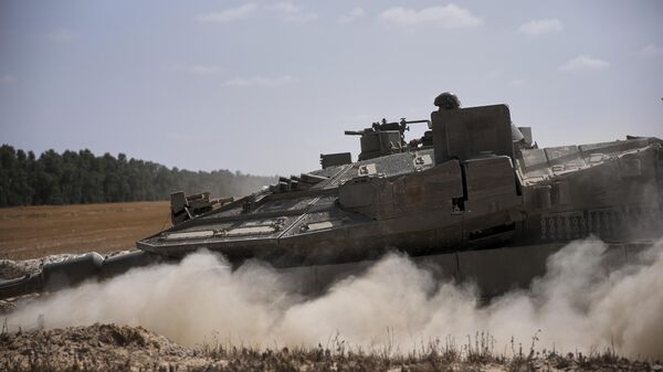 Lực lượng Israel di chuyển dọc biên giới với Dải Gaza, miền nam Israel, thứ Hai, ngày 19 tháng 5 năm 2025. - Sputnik Việt Nam