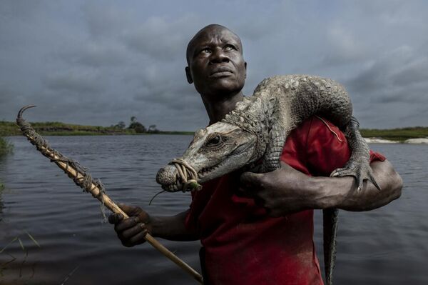 &quot;Brice with his catch&quot; của Thomas Nicolon, tác phẩm đoạt giải nhất ở hạng mục &quot;Những khuôn mặt và nhân vật hấp dẫn&quot; của cuộc thi Siena International Photo Awards 2025 - Sputnik Việt Nam