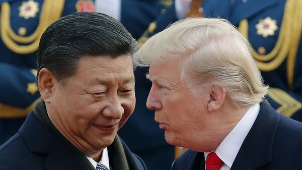FILE - In this Nov. 9, 2017, file photo, U.S. President Donald Trump, right, chats with Chinese President Xi Jinping during a welcome ceremony at the Great Hall of the People in Beijing - Sputnik Việt Nam