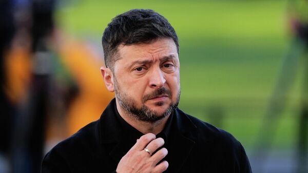 Volodymyr Zelensky arrives at the Bellevue Palace for talks with German President Frank-Walter Steinmeier in Berlin, Germany, Monday, Dec. 15, 2025. - Sputnik Việt Nam