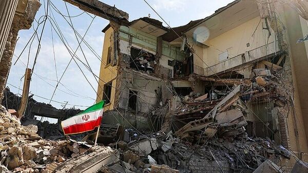 Các tòa nhà bị phá hủy sau các cuộc không kích của Mỹ và Israel vào Tehran. - Sputnik Việt Nam