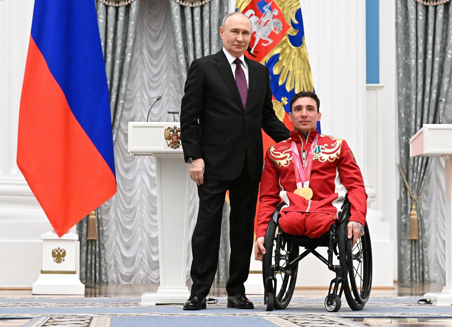 Tổng thống Nga Vladimir Putin tại lễ trao giải thưởng nhà nước cho các vận động viên Nga đoạt huy chương và chiến thắng tại Thế vận hội Paralympic mùa đông lần thứ XIV ở Ý - Sputnik Việt Nam, 1920, 19.03.2026