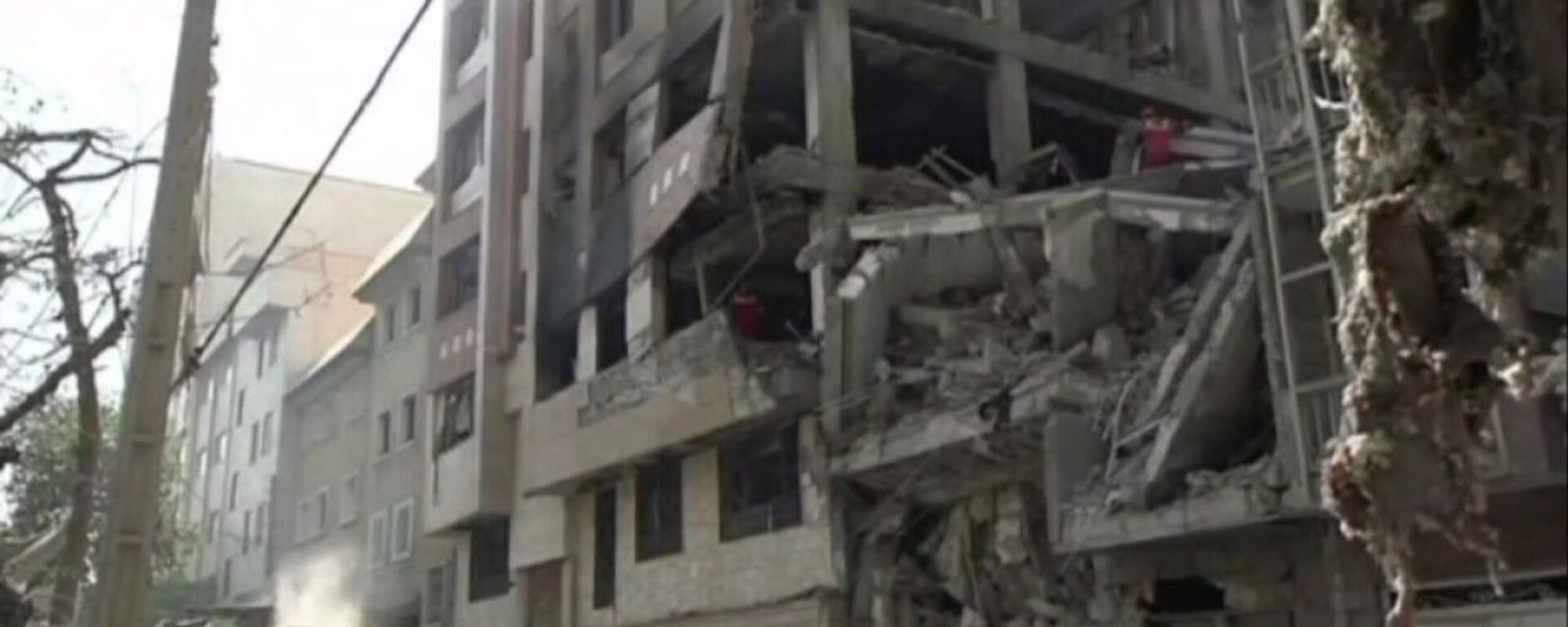 Một ngôi nhà ở trung tâm Tehran bị phá hủy trong một cuộc không kích của Israel. - Sputnik Việt Nam, 1920, 22.03.2026