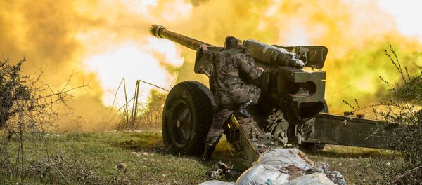 Các xạ thủ của quân đội Syria nã pháo vào các cứ điểm ở tỉnh Idlib, đông bắc Syria - Sputnik Việt Nam