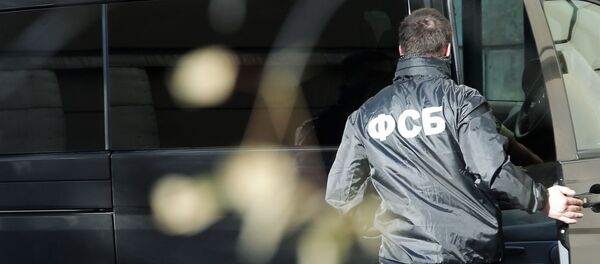 Nhân viên của Cơ quan An ninh Liên bang Nga ngồi trong xe - Sputnik Việt Nam