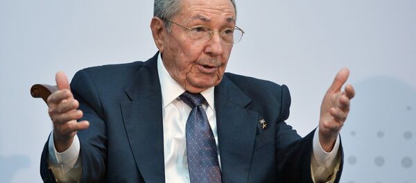Cuba's President Raul Castro speaks with US President Barack Obama (out of frame) on the sidelines of the Summit of the Americas at the ATLAPA Convention center on April 11, 2015 in Panama City - Sputnik Việt Nam