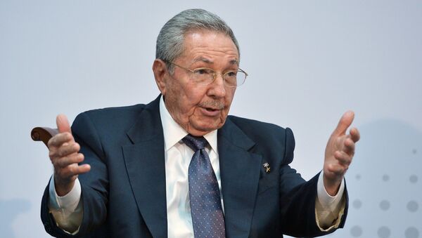 Cuba's President Raul Castro speaks with US President Barack Obama (out of frame) on the sidelines of the Summit of the Americas at the ATLAPA Convention center on April 11, 2015 in Panama City - Sputnik Việt Nam