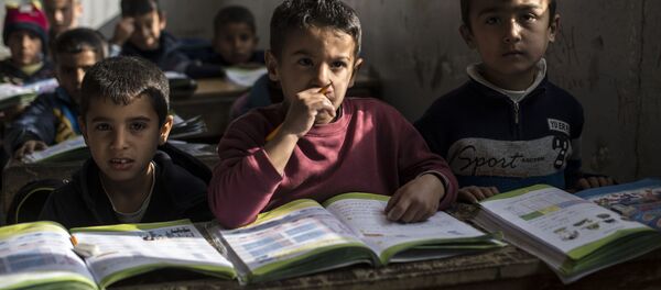 Học sinh của một trường học tại khu tái định cư người tị nạn - Sputnik Việt Nam