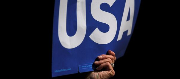 Supporters wave USA posters while US President Barack Obama speaks during a rally in support of US Democratic presidential candidate Hillary Clinton in front of Independence Hall during their final rally on the eve of election day in Philadelphia, Pennsylvania November 7, 2016. - Sputnik Việt Nam