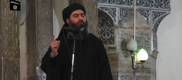 This July 5, 2014 photo shows an image grab taken from a propaganda video released by al-Furqan Media allegedly showing the leader of the Islamic State (IS) jihadist group, Abu Bakr al-Baghdadi, aka Caliph Ibrahim, adressing Muslim worshippers at a mosque in the militant-held northern Iraqi city of Mosul - Sputnik Việt Nam