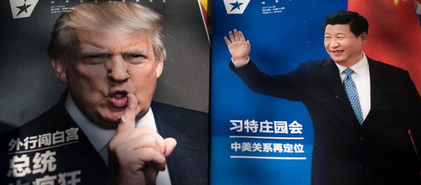 Magazines featuring front pages of US President Donald Trump (L) and China's President Xi Jinping (R) are displayed at a news stand in Beijing - Sputnik Việt Nam