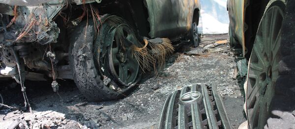 Сгоревшие автомашины миссии ОБСЕ - Sputnik Việt Nam