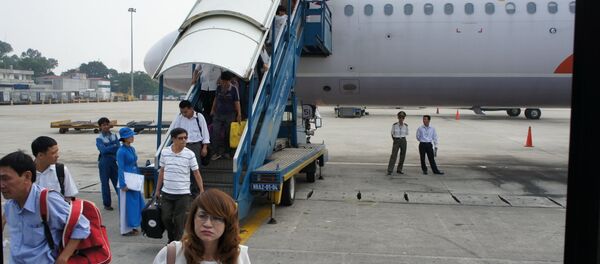 Một chuyến bay khách mua vé của Vietnam Airlines song lên máy bay của Cambodia Angkor Air - Sputnik Việt Nam