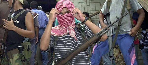 Боевики из филиппинской воинственной террористической исламистской группы Абу Сайяф. Архивное фото - Sputnik Việt Nam