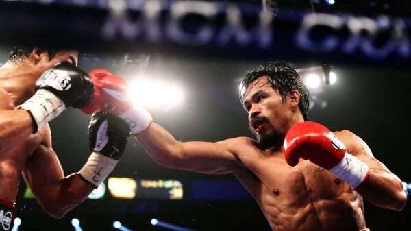 Vị trí thứ hai thuộc về võ sĩ quyền Anh người Philippines Manny Pacquiao.  - Sputnik Việt Nam