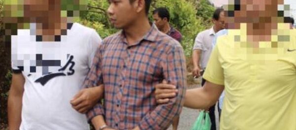 Lê Lâm Hưng lúc bị bắt. - Sputnik Việt Nam