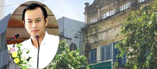 Hai căn nhà được ghép chung một số tại phố Nguyễn Thái Học (phía trước ở tầng 1 màu đỏ và màu xanh) được cho là đang được sử dụng bởi gia đình Bí thư Nguyễn Xuân Anh. - Sputnik Việt Nam