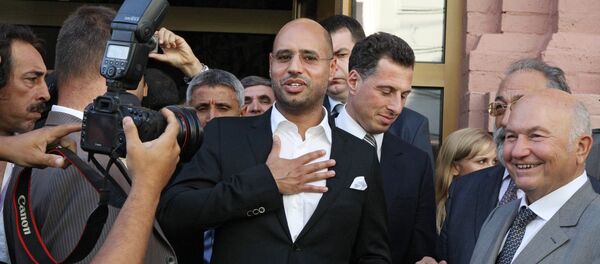 Saif al-Islam Gaddafi visits The Desert is Not Silent exhibition of Libya's ancient and contemporary art. File photo Saif al-Islam Gaddafi visits The Desert is Not Silent exhibition of Libya's ancient and contemporary art. File photo - Sputnik Việt Nam