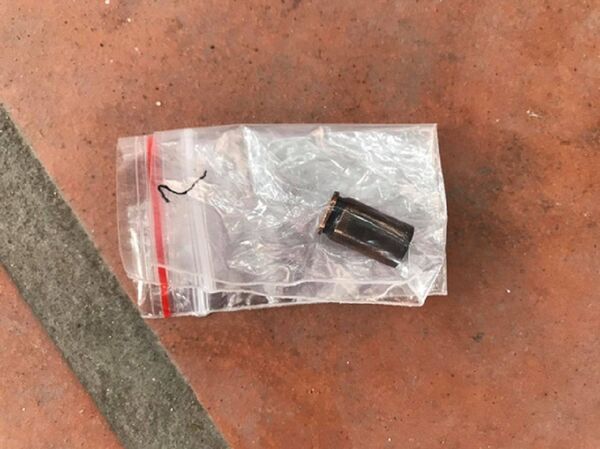 Vỏ đạn được phát hiện ở bụi cây khu vực hiện trường - Sputnik Việt Nam