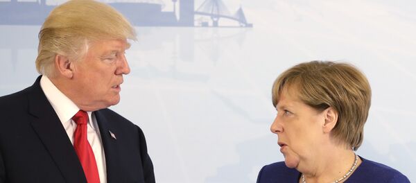 U.S. President Donald Trump, left, and German Chancellor Angela Merkel pose for a photograph prior to a bilateral meeting on the eve of the G-20 summit in Hamburg, northern Germany, Thursday, July 6, 2017 - Sputnik Việt Nam