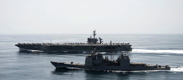 The aircraft carrier USS Theodore Roosevelt (CVN 71) and the guided-missile cruiser USS Normandy (CG 60) operate in the Arabian Sea conducting maritime security operations in this U.S. Navy photo taken April 21, 2015 The aircraft carrier USS Theodore Roosevelt (CVN 71) and the guided-missile cruiser USS Normandy (CG 60) operate in the Arabian Sea conducting maritime security operations in this U.S. Navy photo taken April 21, 2015 - Sputnik Việt Nam