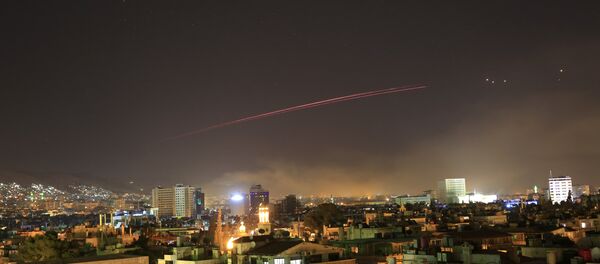 Damascus skies erupt with anti-aircraft fire as the U.S. launches an attack on Syria targeting different parts of the Syrian capital Damascus, Syria, early Saturday, April 14, 2018. Syria's capital has been rocked by loud explosions that lit up the sky with heavy smoke as U.S. President Donald Trump announced airstrikes in retaliation for the country's alleged use of chemical weapons. - Sputnik Việt Nam
