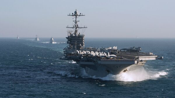 The aircraft carrier group of the United States Navy led by USS Harry S. Truman, front, and a ship escort are seen leaving the port of Norfolk heading for the Middle East - Sputnik Việt Nam