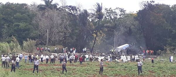 Rescue and search workers on the site where a Cuban airliner with 104 passengers on board plummeted into a yuca field just after takeoff from the international airport in Havana, Cuba, Friday, May 18, 2018. Rescue and search workers on the site where a Cuban airliner with 104 passengers on board plummeted into a yuca field just after takeoff from the international airport in Havana, Cuba, Friday, May 18, 2018. - Sputnik Việt Nam