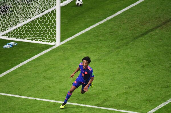 Tác giả bàn thắng Juan Cuadrado (Colombia) vui mừng trong trận đấu vòng bảng của World Cup giữa Ba Lan và Colombia. - Sputnik Việt Nam