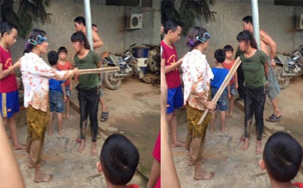 Người phụ nữ bị trói vào cột.  - Sputnik Việt Nam