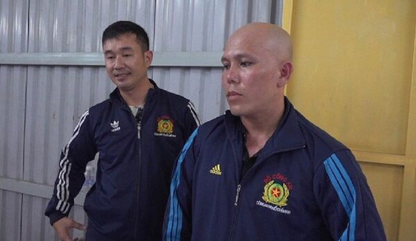 Trần Quốc Đạt, Vũ Quốc Huy, hai đối tượng giả mạo Công an nhân dân trong thời điểm người dân TPHCM tụ tập đông người. - Sputnik Việt Nam