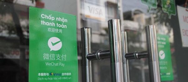 Một cửa hàng ở Khánh Hòa cho phép du khách thanh toán qua WeChat Pay. - Sputnik Việt Nam