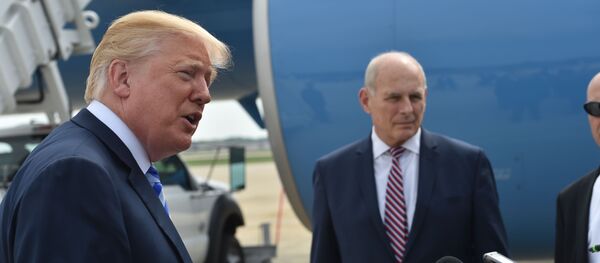 US President Donald Trump speaks to the press before making his way to board Air Force One on May 4, 2018 at Andrews Air Force Base, Maryland as he heads to Dallas, Texas to address the National Rifle Association Leadership Forum. Shown (C) is White House Chief of Staff John Kelly. - Sputnik Việt Nam