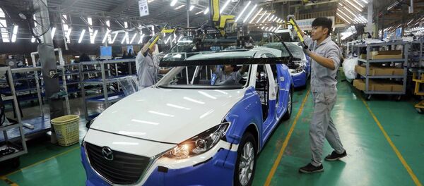 Dây chuyền lắp ráp xe Mazda của Công ty cổ phần ô tô Trường Hải, Khu kinh tế Chu Lai (Quảng Nam). Đây là biểu tượng thành công về hợp tác sản xuất trong lĩnh vực sản xuất và lắp ráp ô tô giữa Việt Nam và Nhật Bản. - Sputnik Việt Nam