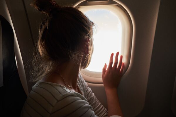 Người phụ nữ đi máy bay - Sputnik Việt Nam