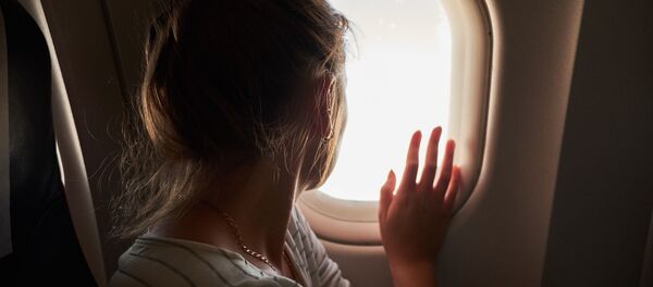 Người phụ nữ đi máy bay Người phụ nữ đi máy bay - Sputnik Việt Nam