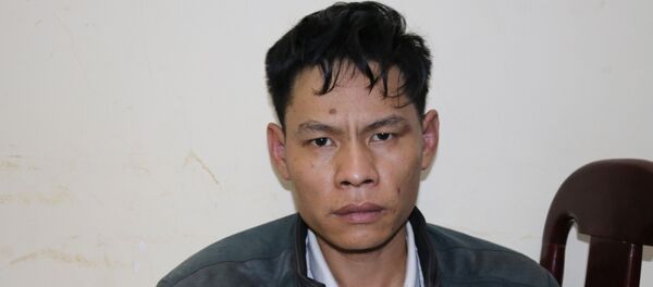 Đối tượng Vì Văn Toán tại cơ quan điều tra.  - Sputnik Việt Nam