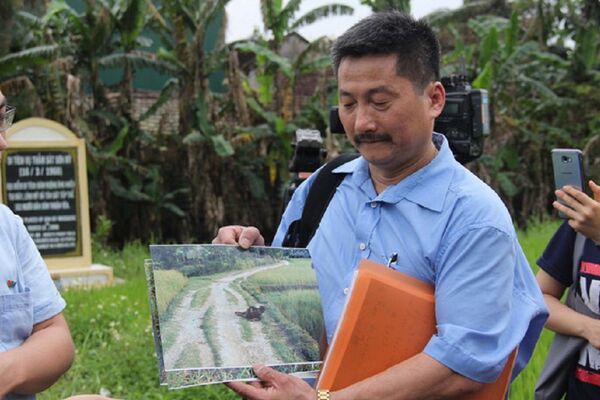 Anh che đạn cho em ở Mỹ Lai: Bức ảnh trở về với sự thật - Sputnik Việt Nam