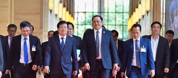 Phó Thủ tướng Trịnh Đình Dũng và Phó Thủ tướng Chính phủ Lào Sonexay Siphandone - Sputnik Việt Nam