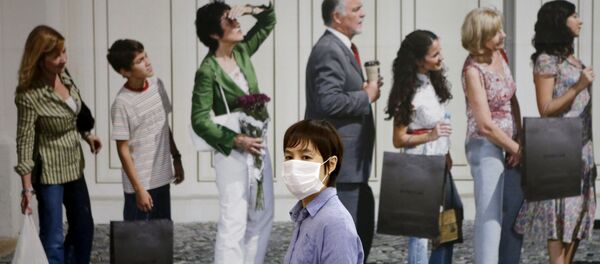 Người phụ nữ trong một mặt nạ y tế. - Sputnik Việt Nam