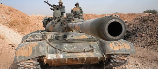 Tổ lái xe tăng T-72 của Sư đoàn 10, Quân Đoàn 2, Quân đội Tự Do Syria tại thành phố Katana (ở Syria) Tổ lái xe tăng T-72 của Sư đoàn 10, Quân Đoàn 2, Quân đội Tự Do Syria tại thành phố Katana (ở Syria) - Sputnik Việt Nam