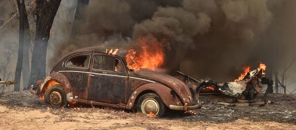Chiếc ô tô bị cháy do cháy rừng ở Úc Chiếc ô tô bị cháy do cháy rừng ở Úc - Sputnik Việt Nam