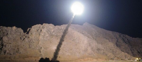 In this picture released by the Iranian state-run IRIB News Agency on Monday, June 19, 2017, a missile is fired from city of Kermanshah in western Iran targeting the Islamic State group in Syria - Sputnik Việt Nam