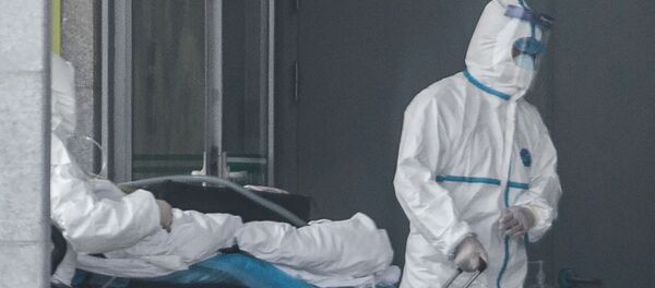 Vận chuyển ngưởi bị nhiễm virus coronavirus ở Vũ Hán, Trung Quốc - Sputnik Việt Nam