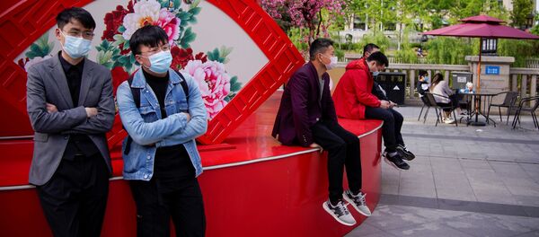 Người deo khẩu trang bảo vệ. Vũ Hán - Sputnik Việt Nam