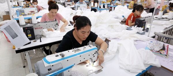 35 học viên của trường thực tập tại Công ty TNHH May Nam Thái Nguyên, sau khi tốt nghiệp được Công ty tiếp nhận vào làm việc. - Sputnik Việt Nam